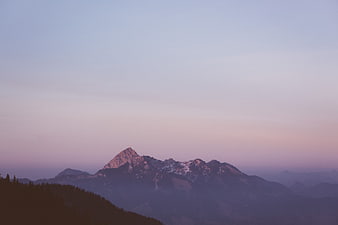 Serene Mountain Landscape at Twilight with Purple Sky