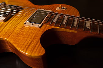 Close-up of a sunburst electric guitar body and neck