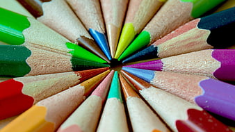 Close-up of colorful pencils arranged in a circle