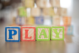 Wooden blocks spelling play on table