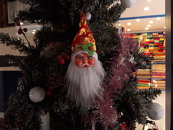Traditional Santa Claus Ornament on Christmas Tree