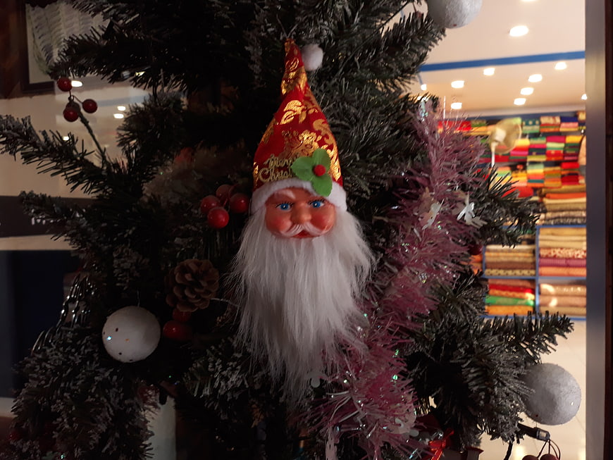 Traditional Santa Claus Ornament on Christmas Tree