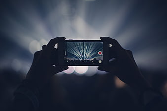 Hands Recording Concert Stage Lights With Smartphone
