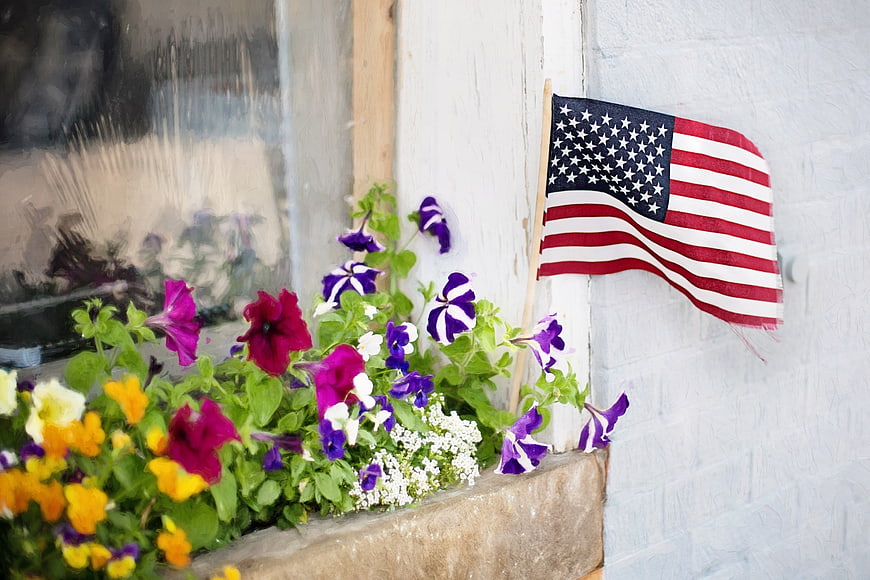 American Flag in Window Box with Colorful Petunias
