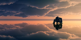 Dramatic Rock Formation Floating in Clouds at Sunset