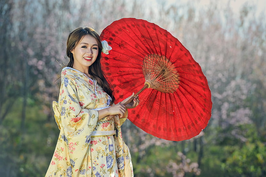 Asian Woman in Floral Kimono Holding Red Umbrella