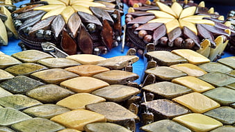 Handcrafted Stone and Wood Adornments on Blue Background