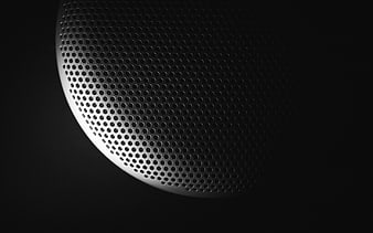 Close-up of perforated metal speaker grille texture