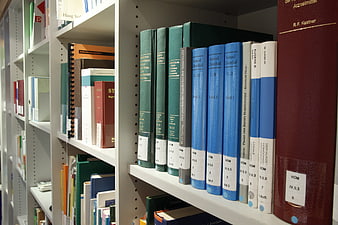 Close-up of medical and scientific books on library shelves