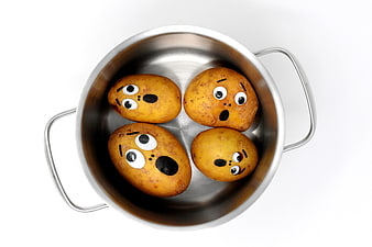 Funny Potatoes With Faces In Metal Pot