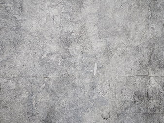 Textured gray concrete wall background with cracks