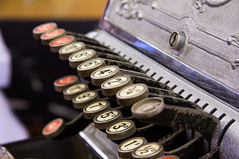 Close-up of vintage cash register keys with numbers