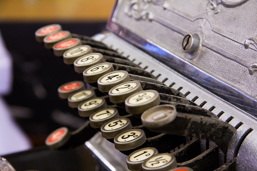 Close-up of vintage cash register keys with numbers