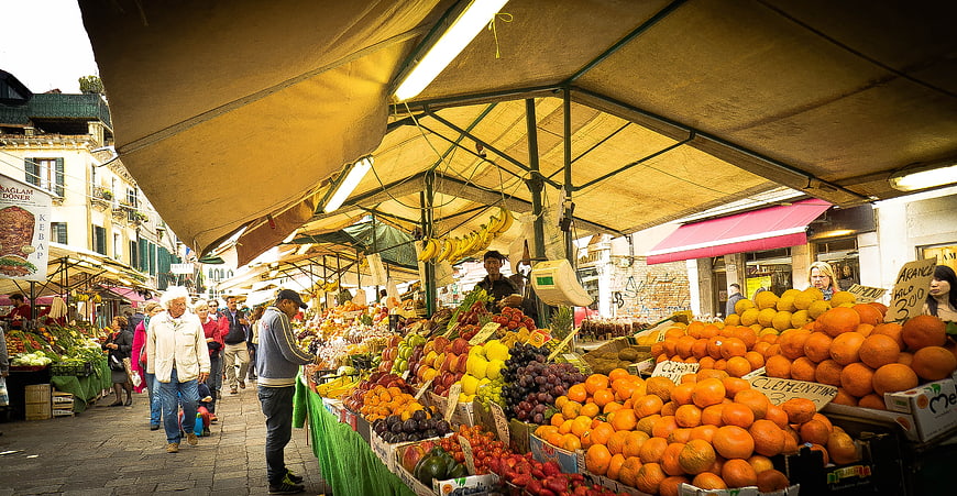 Vibrant Outdoor Fruit and Vegetable Market Stall in Venice, Italy