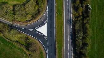 Aerial View of T-Junction Road in Green Countryside