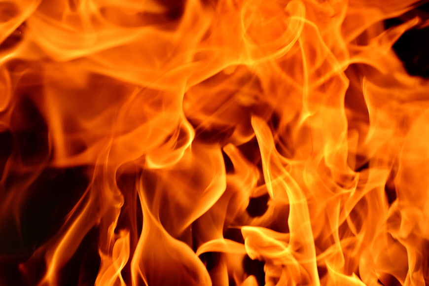 Close-up of intense orange and yellow flames burning