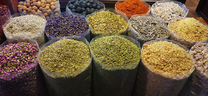 Colorful Assortment of Dried Spices and Herbs in Market Bags