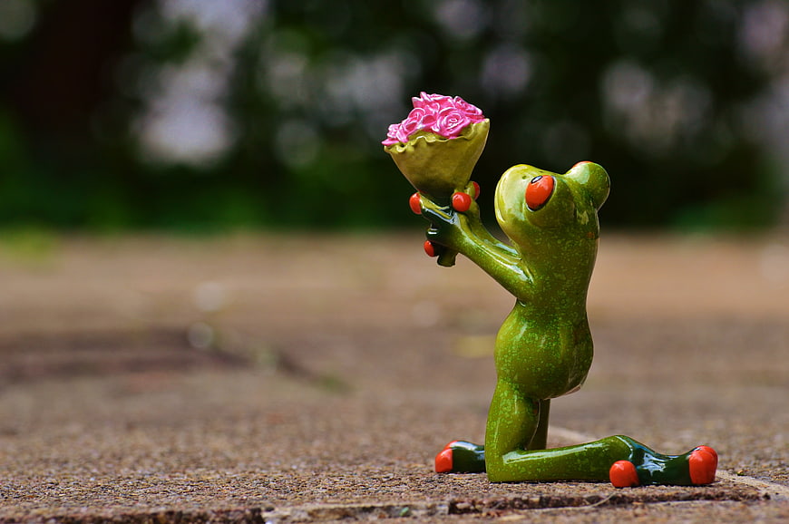 Cute Green Frog Figurine Kneeling with Pink Roses