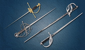 Four antique swords and rapiers on blue background