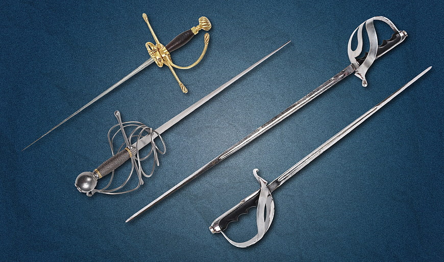 Four antique swords and rapiers on blue background