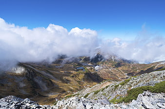 Majestic Mountain Landscape with Clouds and Alpine Lake