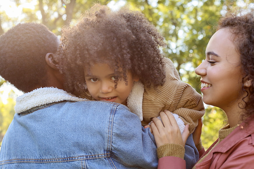 Happy African American Family Portrait Outdoors in Autumn