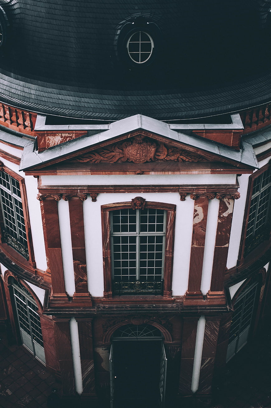 Low angle view of classical red and white building facade