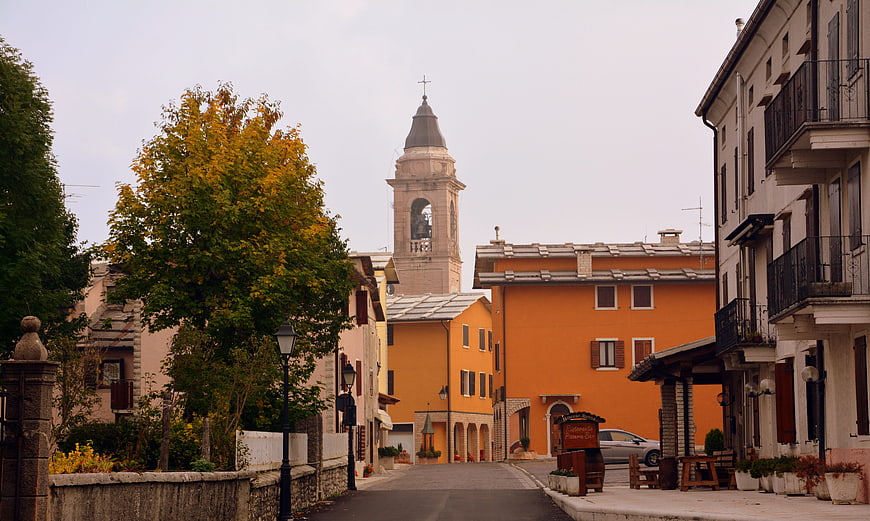 Quiet Italian Village Street with Bell Tower and Autumn Trees
