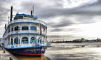 Blue and white paddle steamer docked at Hamburg port