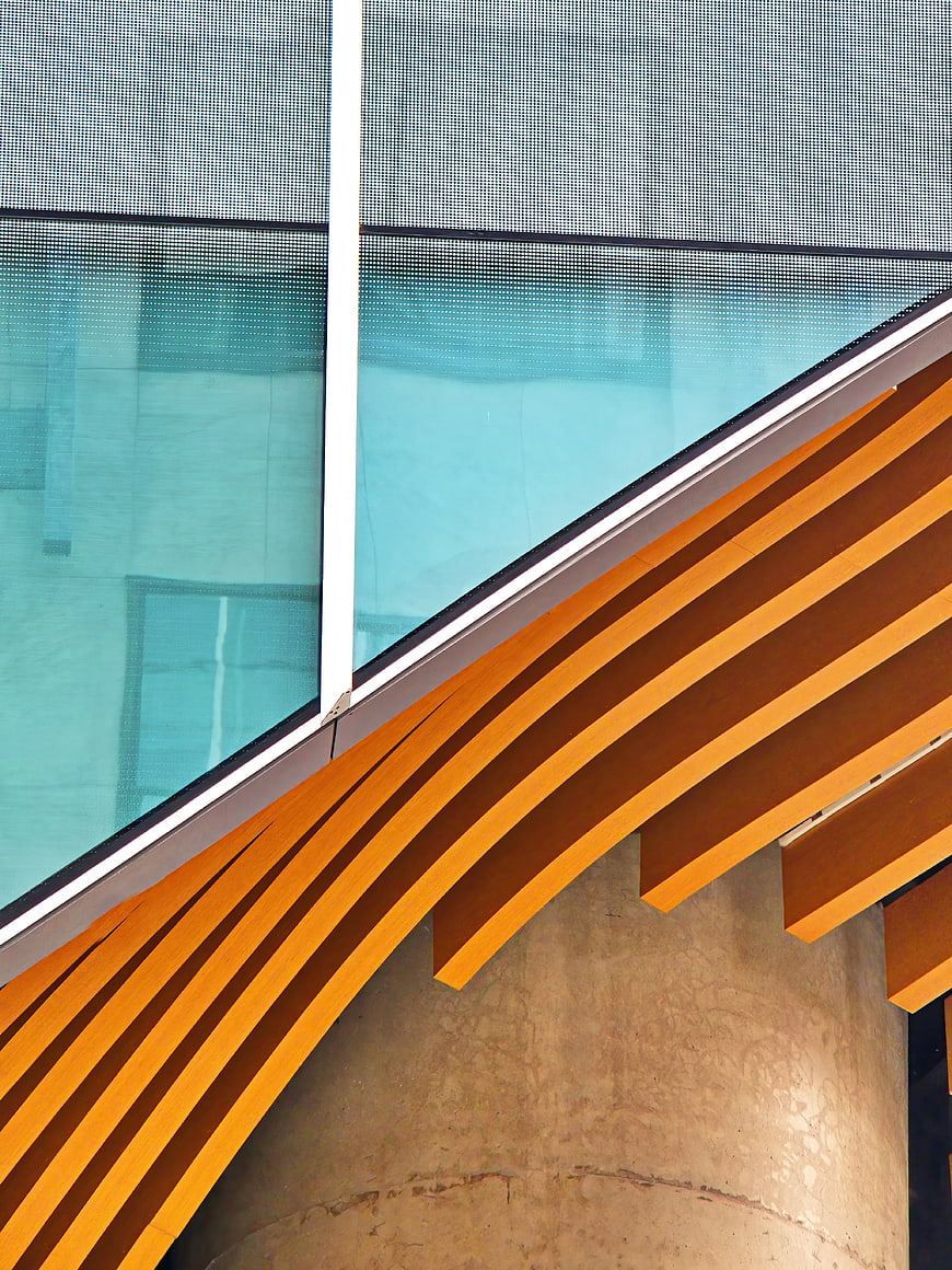 Modern architectural detail with wooden slats and glass facade