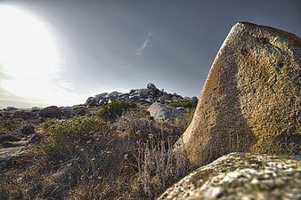 Rugged Rocky Landscape with Large Boulders and Dry Vegetation