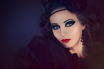 Dramatic Gothic Woman Portrait with Bold Black and Red Makeup