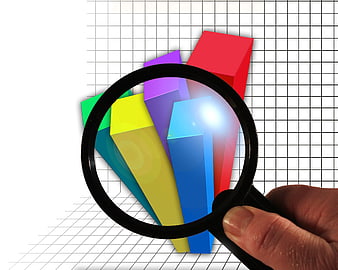 Hand holding magnifying glass over colorful 3D bar chart