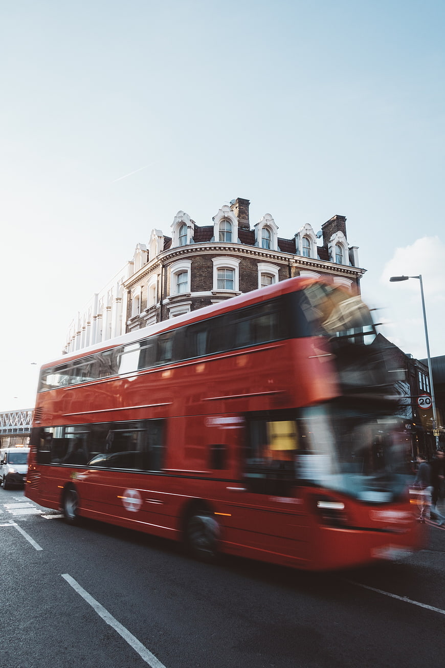 Motion Blur Red Double Decker Bus in London Street