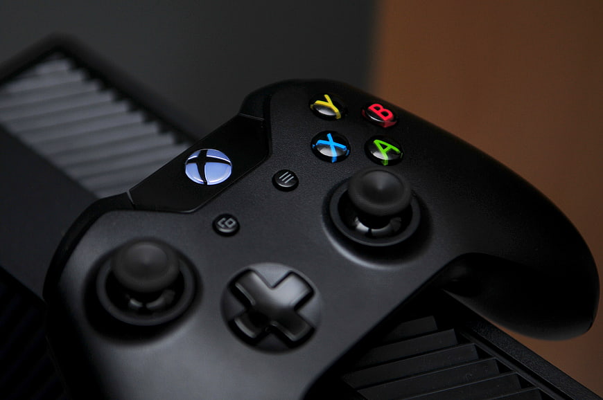 Close-up of Black Xbox Controller on Console