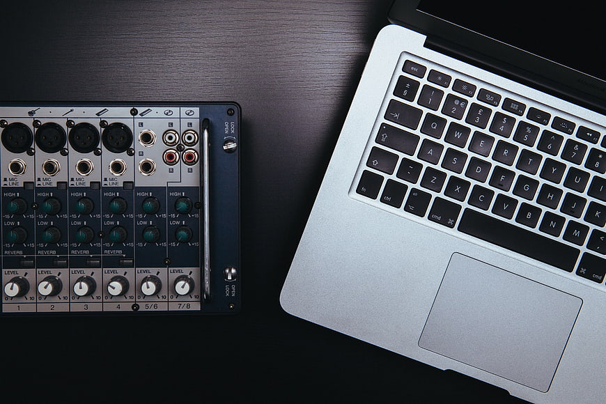 Audio Interface and Laptop on Dark Desk