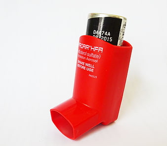 Red ProAir HFA Albuterol Inhaler With Spacer Device On White Background