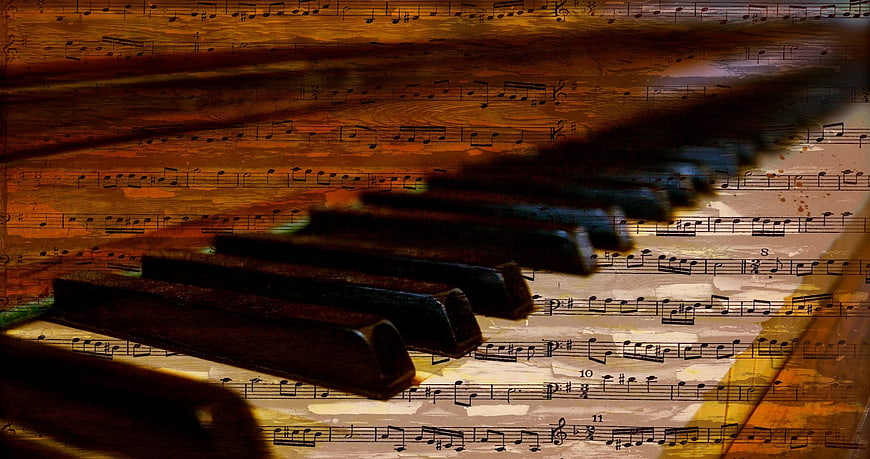 Vintage Piano Keys Over Old Sheet Music Background