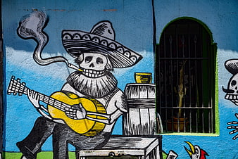 Mexican Day of the Dead Skeleton Mural on Blue Wall