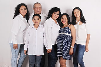 Family Portrait of Six People in White Shirts and Blue Jeans