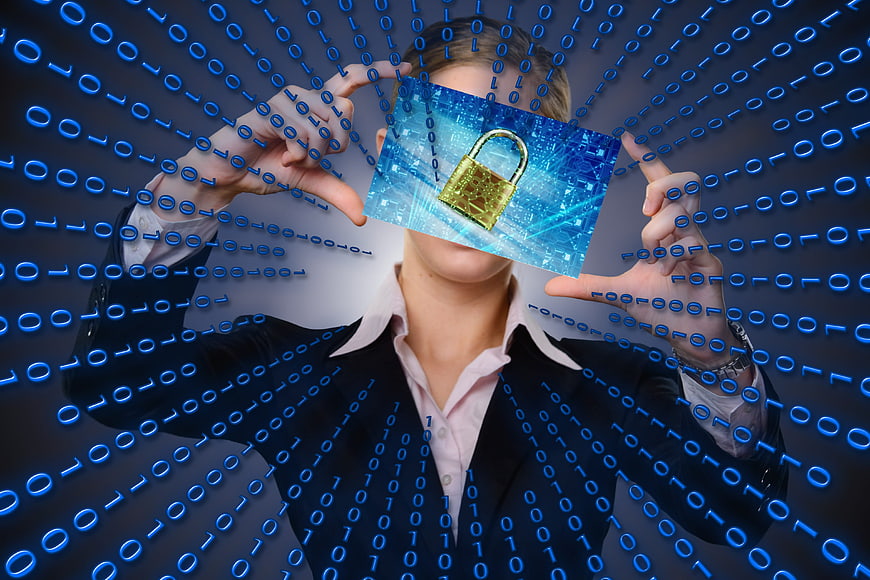 Businessman holding digital padlock with binary code background