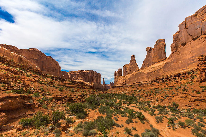 Red Rock Canyon Landscape with Blue Sky and White Clouds
