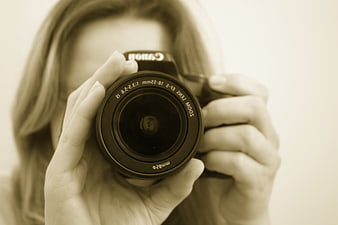 Female Photographer Holding Canon DSLR Camera Lens Close Up