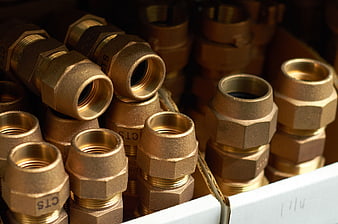 Close-up of brass plumbing fittings in a box