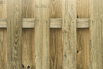 Vertical wooden fence planks with rustic texture and natural grain