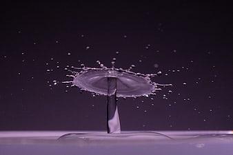 High-speed water drop splash crown on dark background