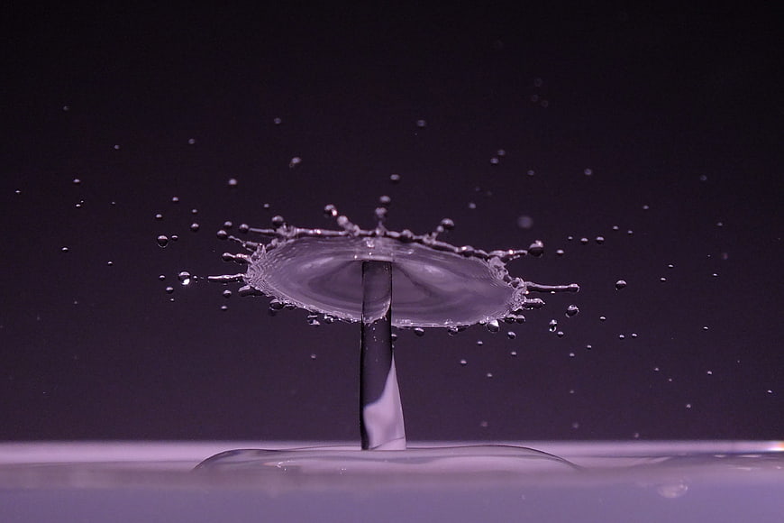 High-speed water drop splash crown on dark background
