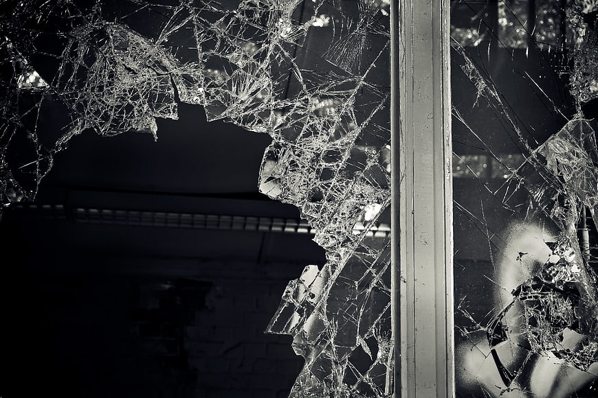 Shattered Window Glass in Abandoned Industrial Building