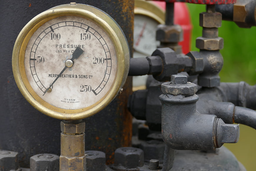 Vintage Brass Pressure Gauge on Industrial Steam Engine