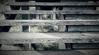Weathered Wooden Boardwalk Planks with Grass Background